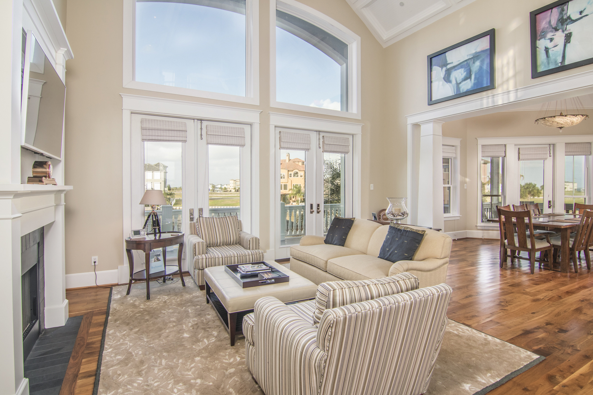 Living room with tall windows and bright natural light