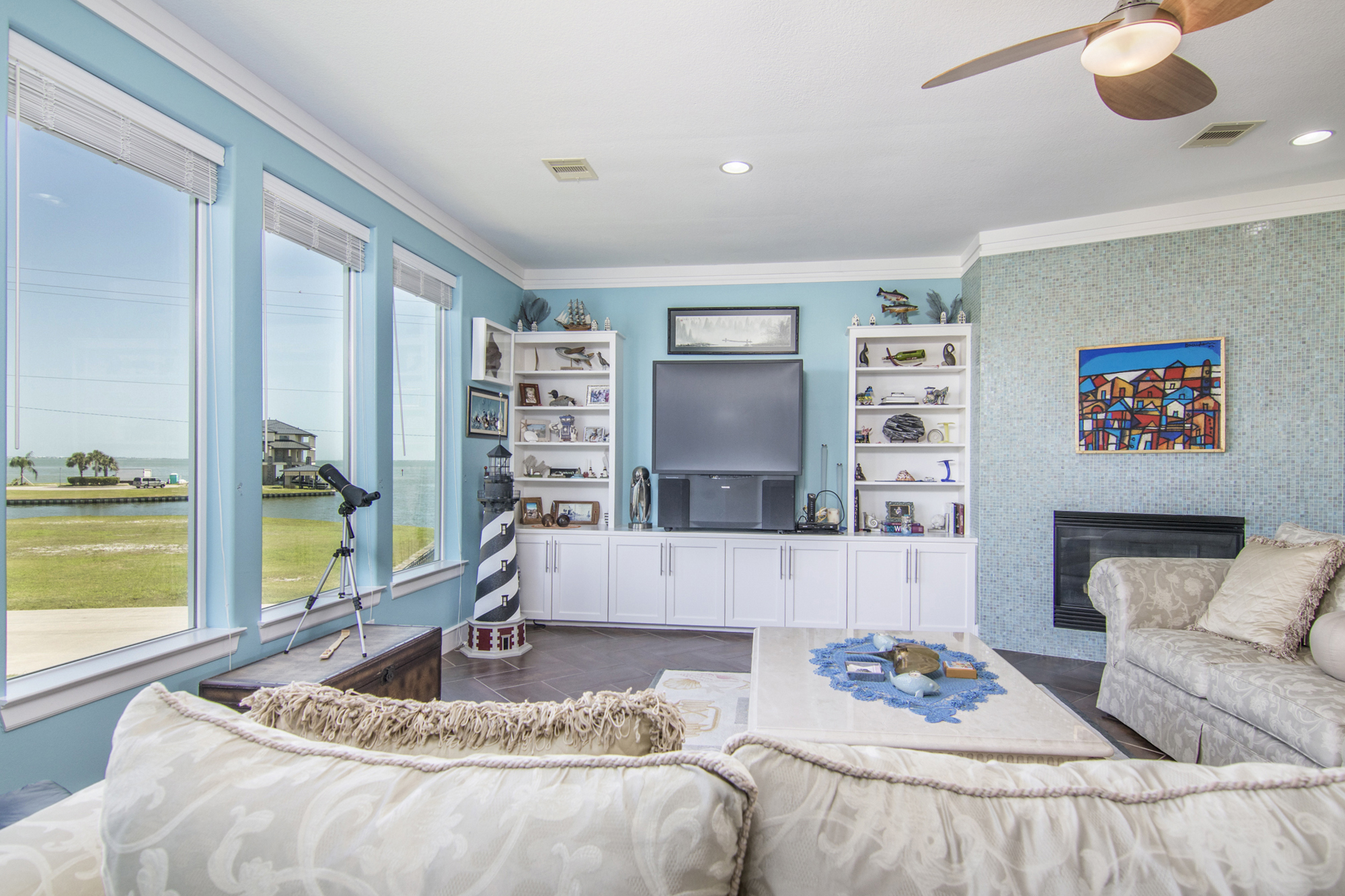 Interior room with large windows overlooking water